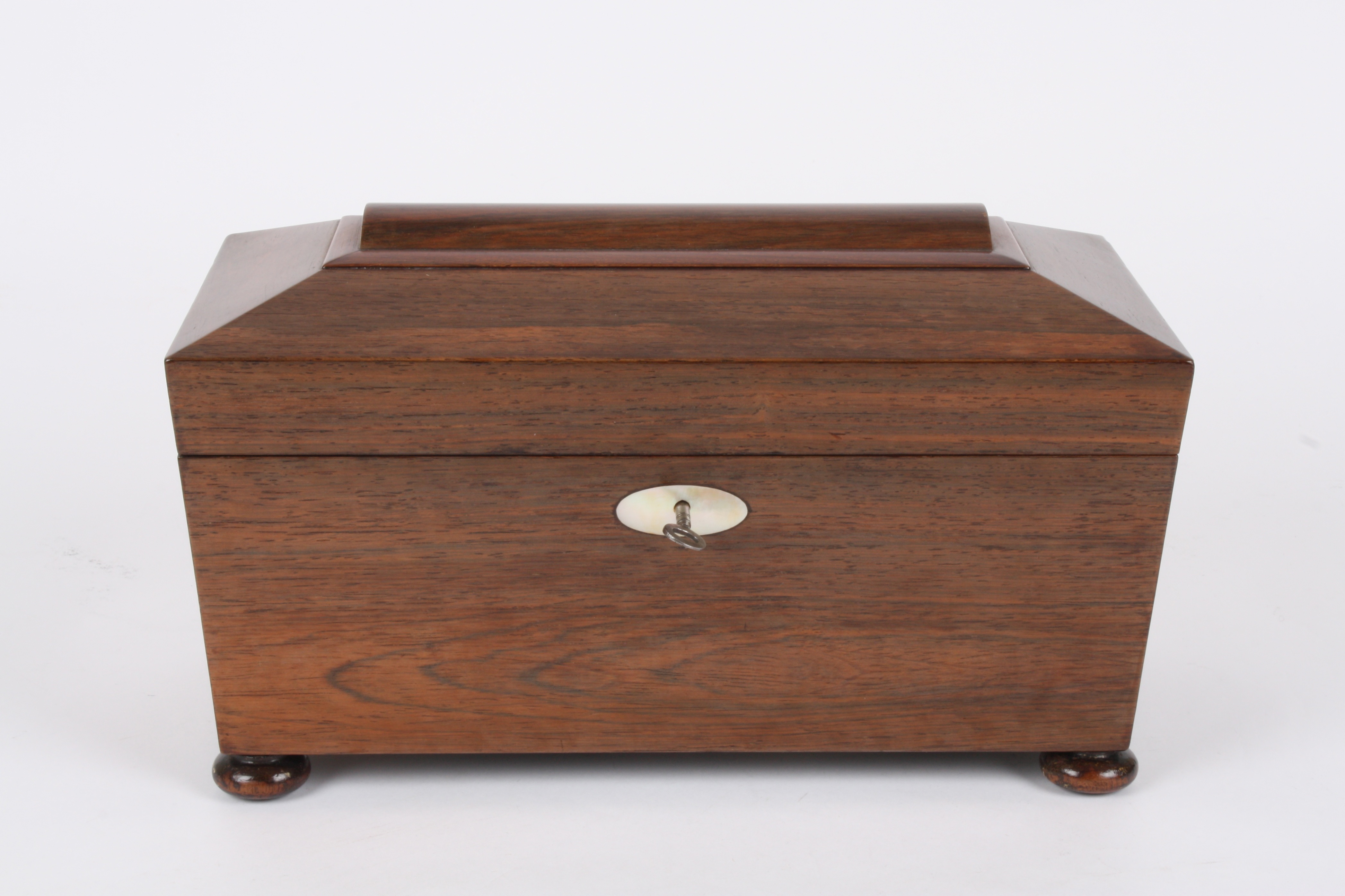 A 19th century sarcophagus shaped rosewood tea caddy
the interior with glass mixing bowl and twin