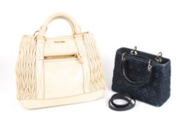 Two designer bagsthe first a navy denim Christian Dior small bag with detachable long strap,