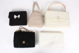 A collection of four Charles Jourdan bags.comprising of black suede with bow, black suede with