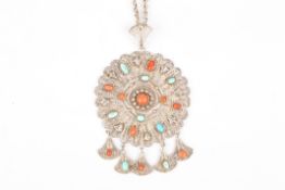 A South American white metal filigree medallionthe large central roundel set with turquoise and