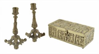 A gothic brass casket the hinged casket of rectangular form with four panels to the lid depicting