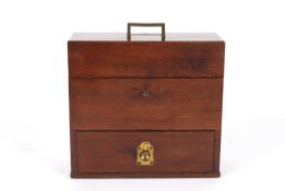 An early 19th century mahogany travelling medicine boxthe hinged top opening to reveal bottles