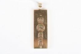 A 9ct gold ingotof rectangular pendant form, hallmarked London 1977.Dimensions: 29.8 grams.