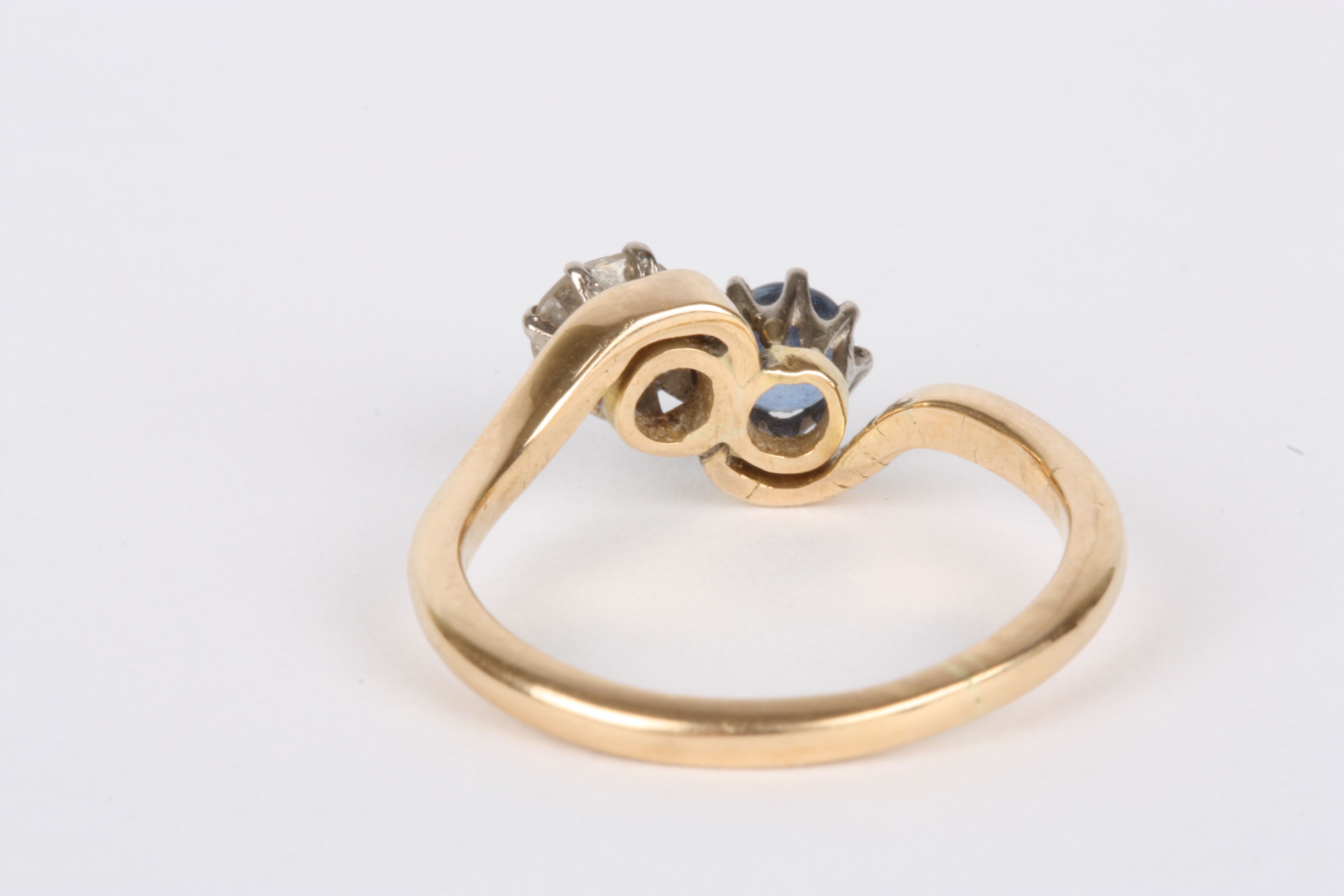 A gold coloured metal, diamond and sapphire two stone ring
set with diamond weighing approximately - Image 2 of 2