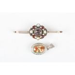 A gold bar brooch and a pendant
the bar brooch mounted with a central stone surrounded by garnets