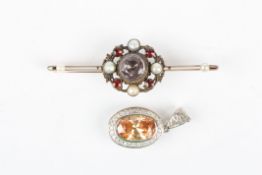 A gold bar brooch and a pendantthe bar brooch mounted with a central stone surrounded by garnets