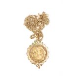 A Victorian 1889 22ct gold full sovereign
in an ornate foliate 9ct gold mount, on a 9ct gold chain.