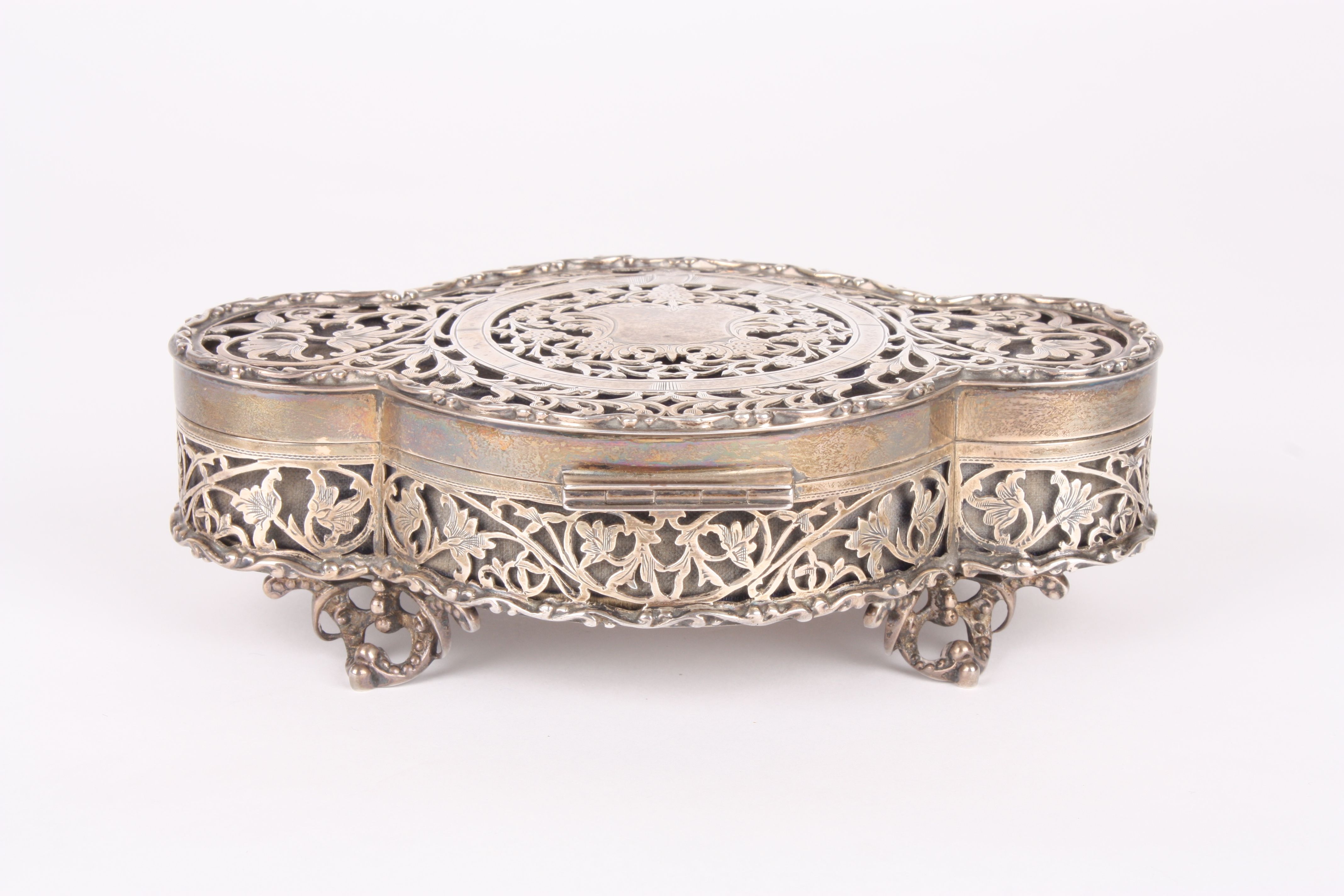 A George V pierced silver jewellery casket
hallmarked 1922, of lozenge shape the lid with vacant - Image 2 of 5