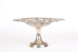 An Edwardian pierced silver tazzahallmarked 1903, with pierced foliate decoration and scrolled rim,