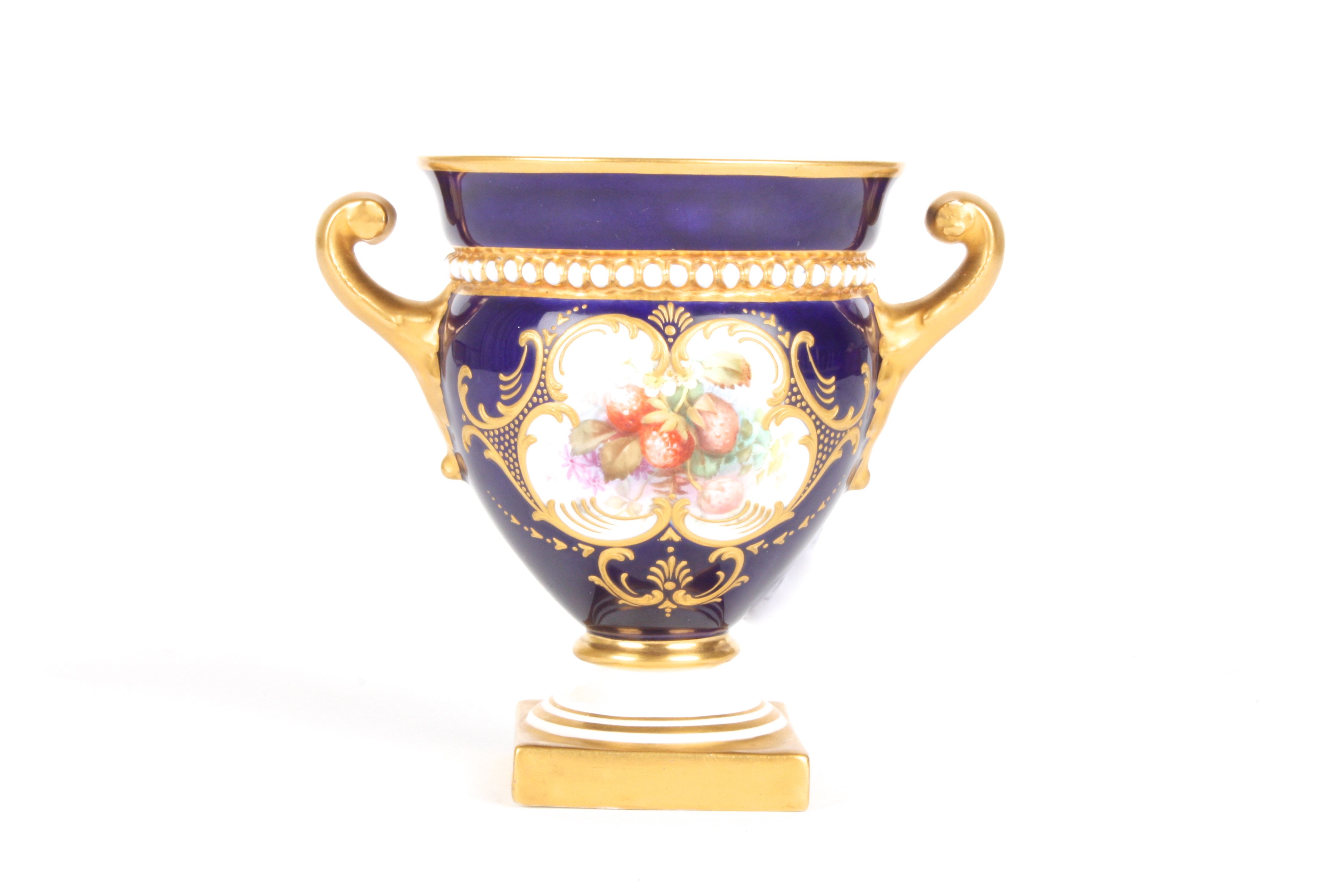 A small Royal Worcester painted campagna vase
signed by William Hawkins, painted with a panel of