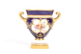 A small Royal Worcester painted campagna vasesigned by William Hawkins, painted with a panel of