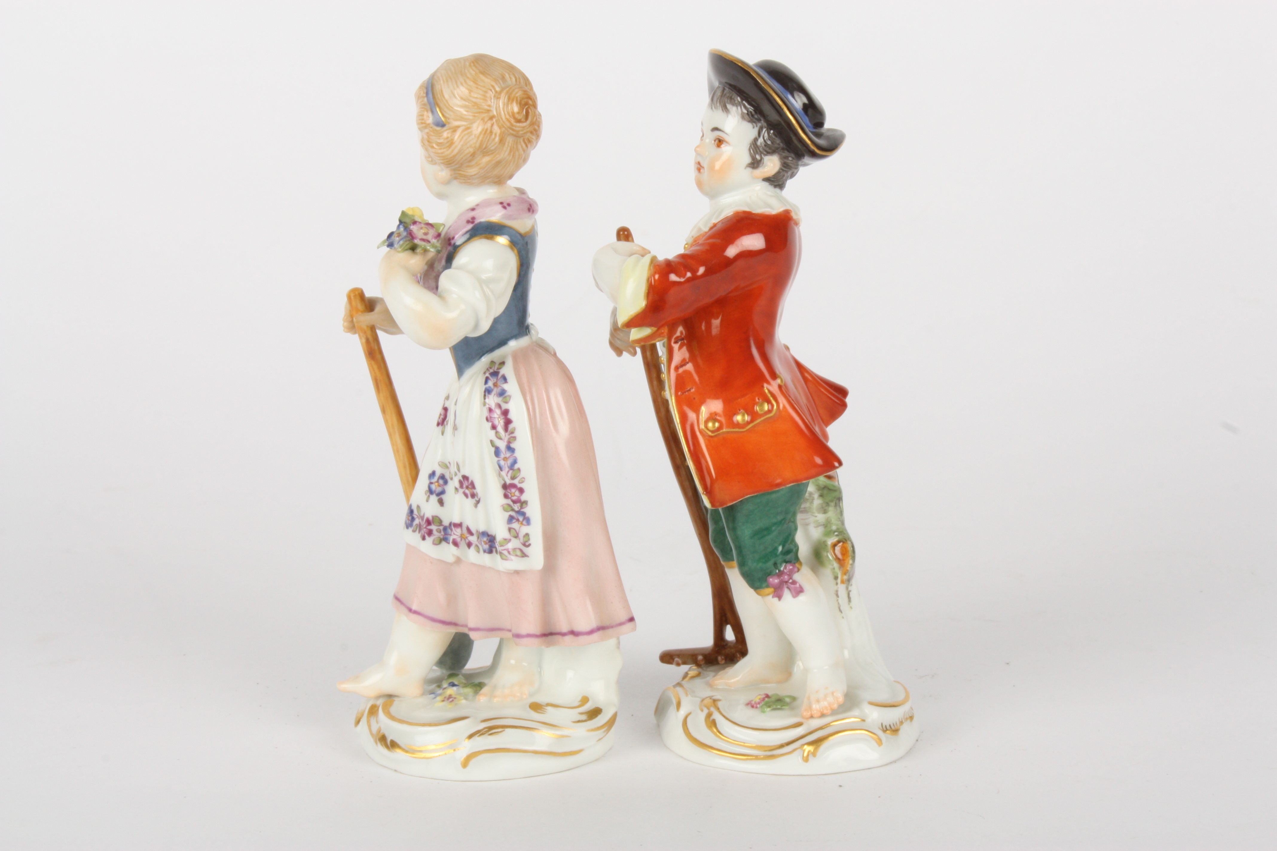 Pair of Late 20th century Meissen figures modelled as a gardening boy holding a rake and girl - Image 3 of 5