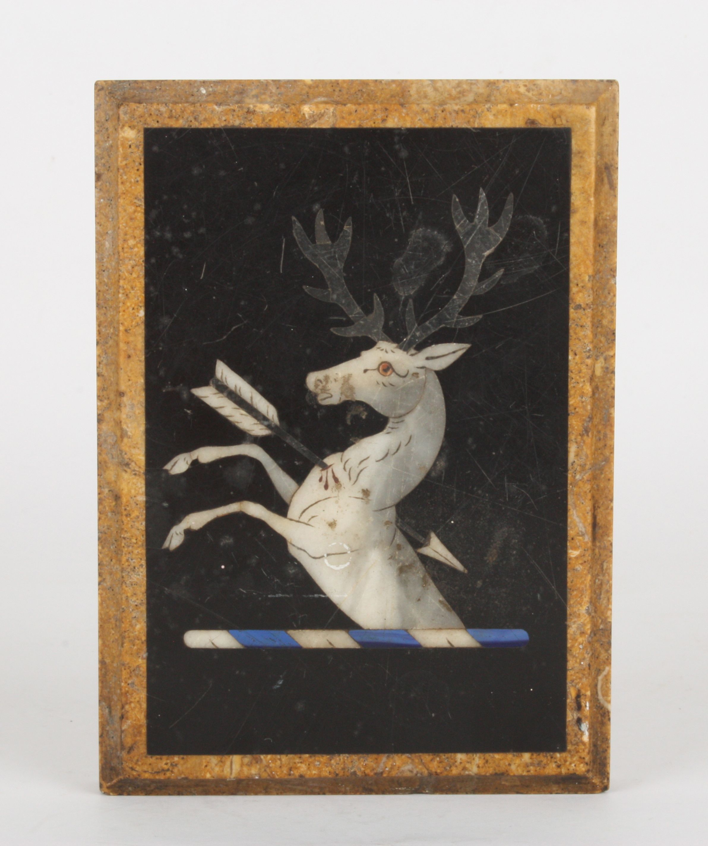 A Victorian pietra dura inlaid marble paperweight
decorated with a heraldic crest of a white stag