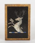 A Victorian pietra dura inlaid marble paperweightdecorated with a heraldic crest of a white stag