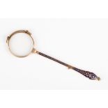 A pair of Victorian French gilt metal and enamel lorgnettes
the lozenge shaped handle inset with