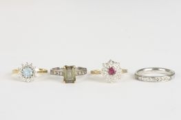 Three 18ct gold dress rings and anotherincluding a ruby and diamond ring, an aquamarine and diamond