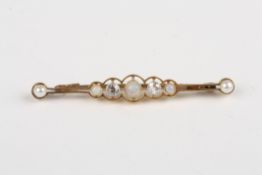 A Victorian 15ct gold, open and diamond bar broochset with three opals interspersed with two old