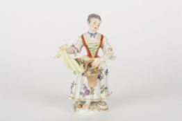 Late 20th century Meissen figure of a gardening girl, after Kaendler, modelled standing holding a