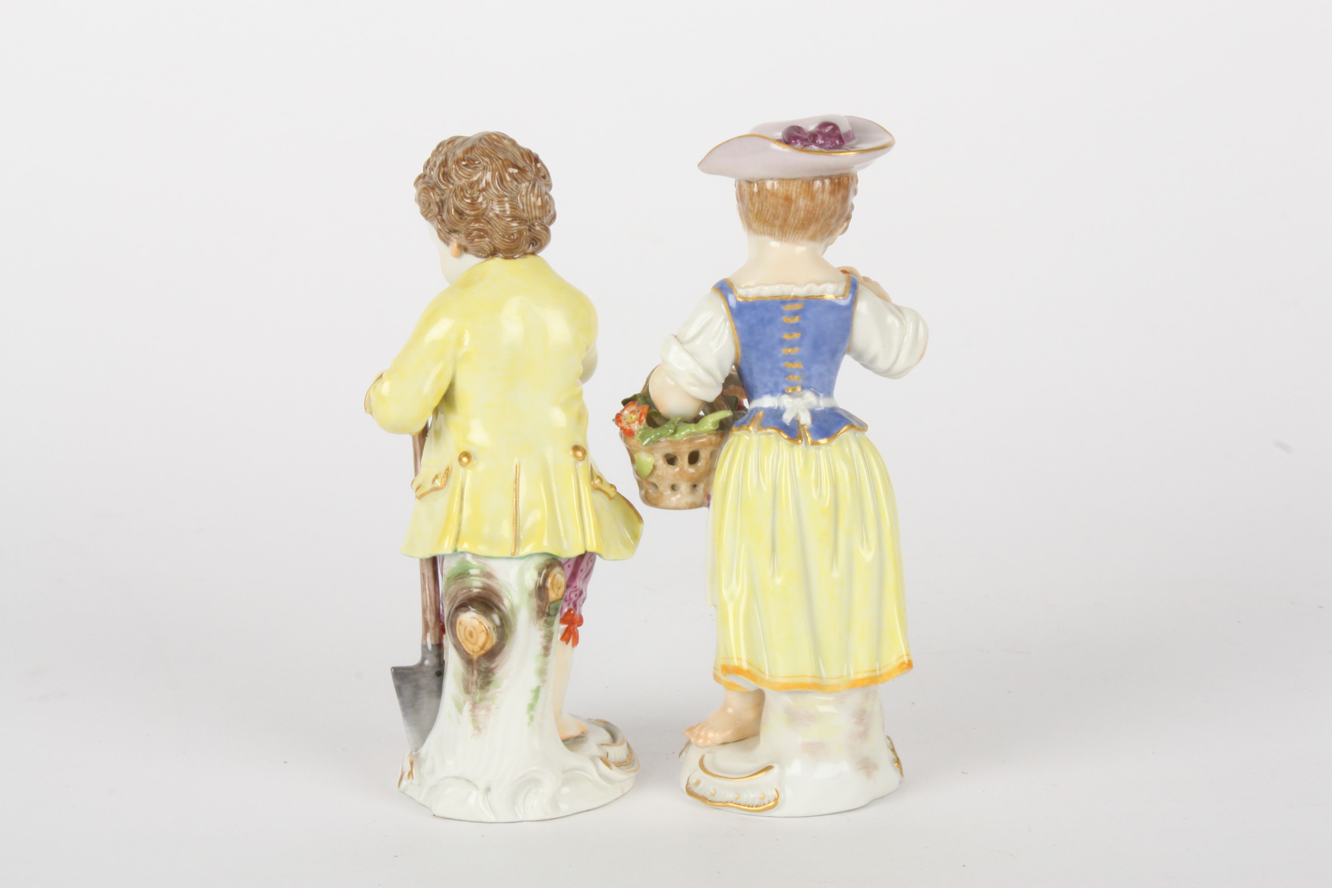 Pair of late 20th century Meissen gardener boy and girl figures, each modelled standing, boy holding - Image 2 of 5