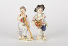 Pair of late 20th century Meissen gardener boy and girl figures, each modelled standing, the girl