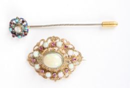 A Hungarian silver gilt broochwith pierced decorated and mounted with central opal surrounded by