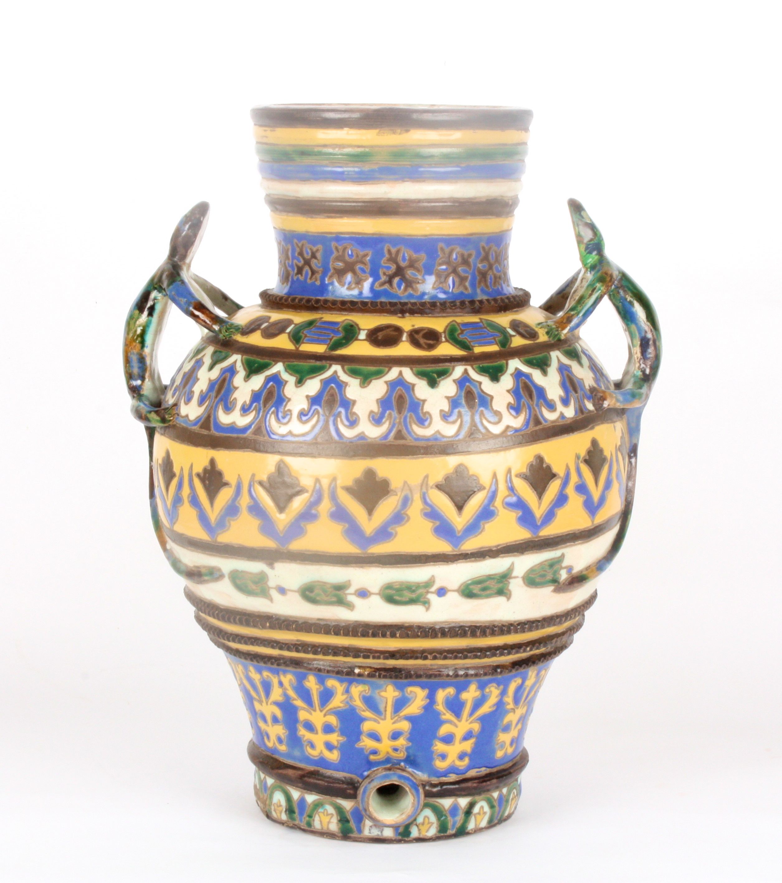 A large Persian pottery water butt and cover
naively potted and decorated in bright enamel colours