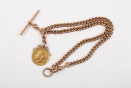 A 9ct gold double Albert chain and sovereignthe full 22ct gold sovereign dated 1912, the Albert