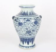 A large late 19th century Chinese blue and white jarof inverted baluster form, the neck decorated