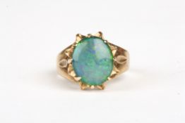 A 9ct gold and opal doublet ringin a foliate eight claw mount, Size M.Condition: Good condition
