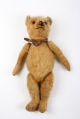 A 1920s Chiltern mohair teddy bearwith articulated mohair head, legs and arms, 45 cm long.