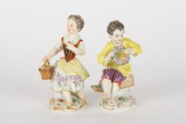 Pair of late 20th century Meissen kinder garden figures, after Kaendler, each seated, the girl