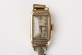 A ladies 9ct gold Rolex wrist watchcirca 1930, the rectangular silvered dial signed Rolex, with