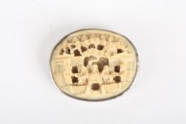 An early 20th century Chinese carved ivory and white metal broochcirca 1900, carved with a scene of