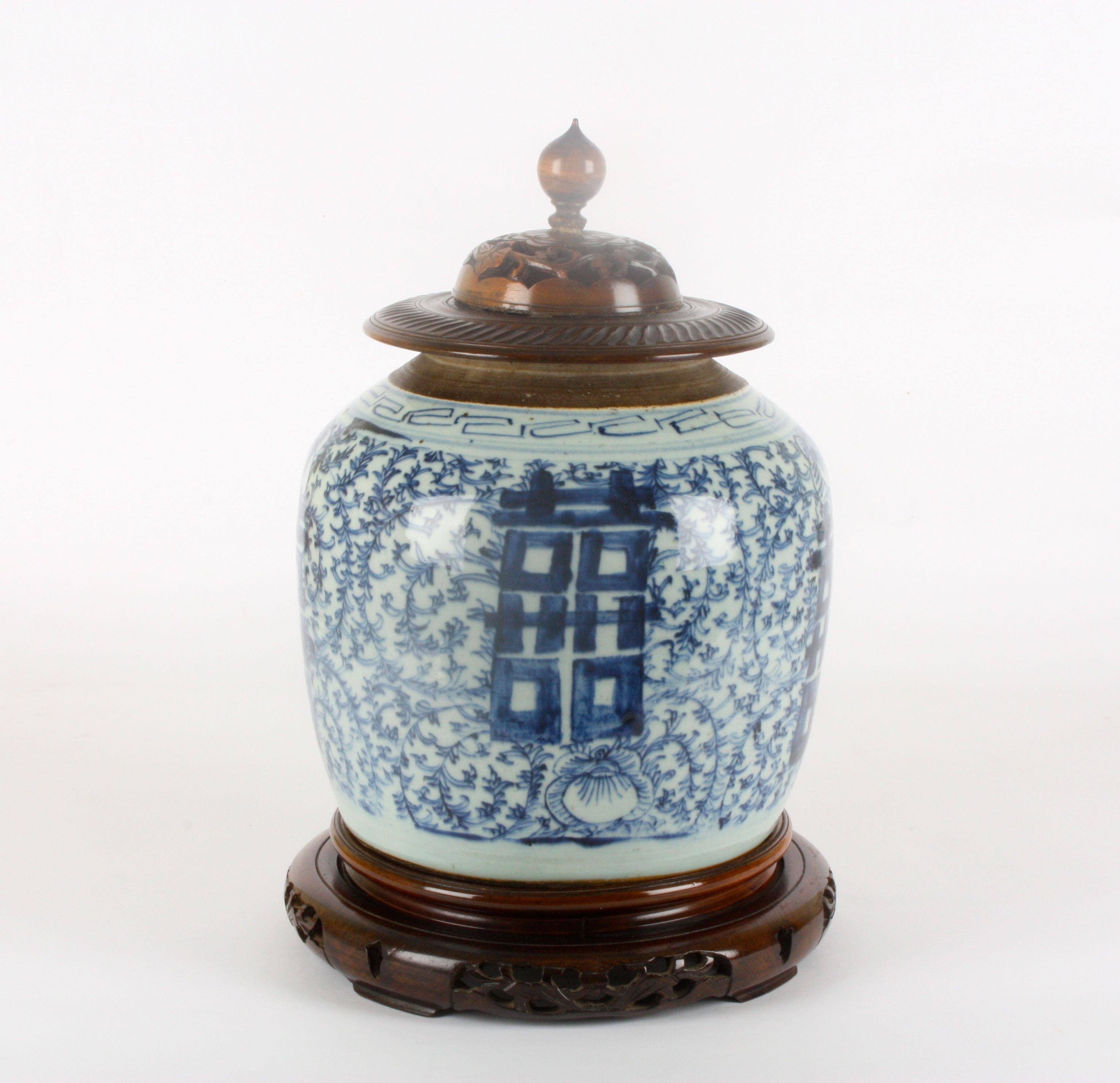 A 19th century Chinese blue and white ginger jar
decorated with large Character marks, surrounded by