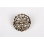 An early 20th century diamond roundel brooch
set with four diamonds weighing approx 0.15cts each,