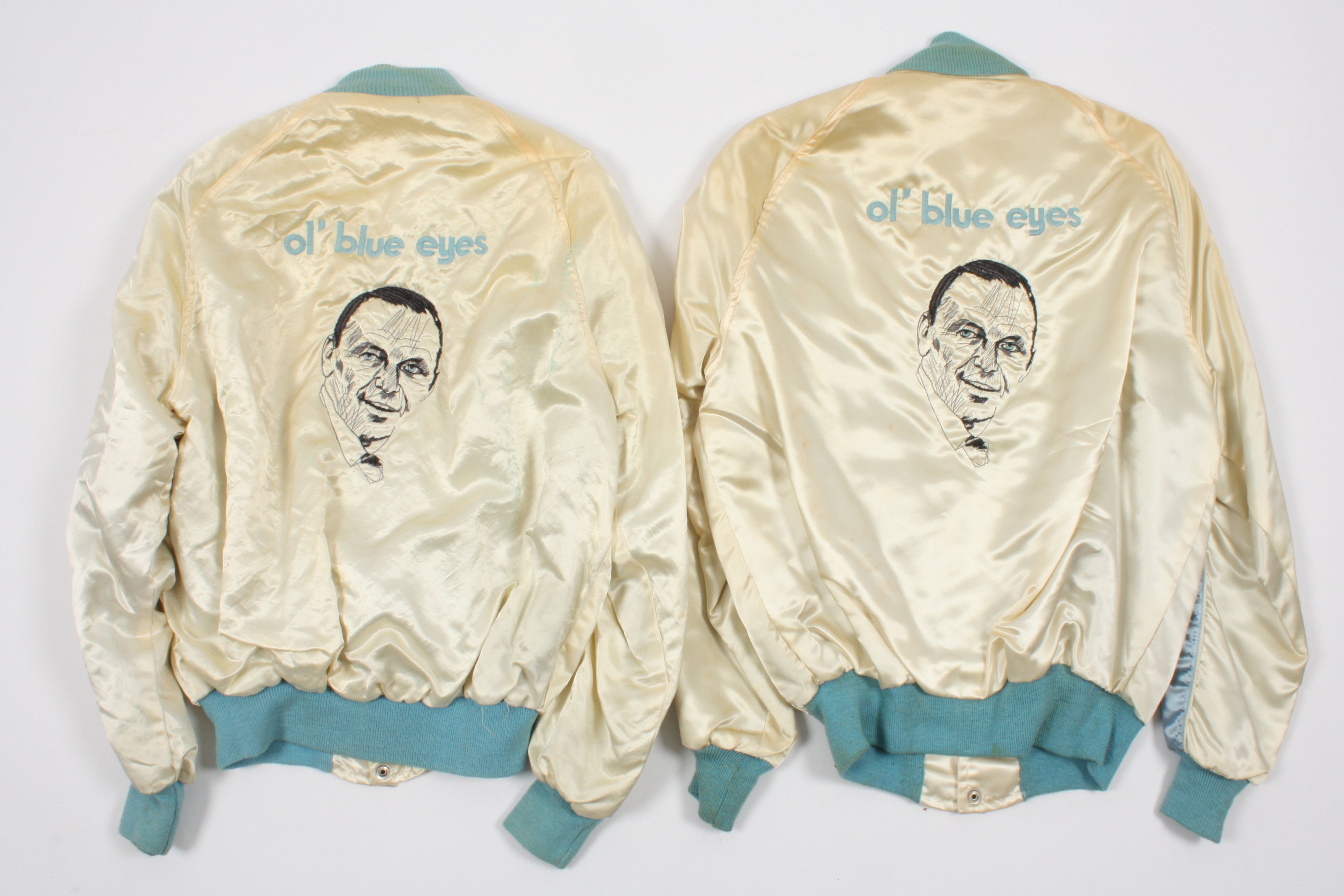 Two Frank Sinatra London Tour jackets
finished in cream and pale blue satin, the backs