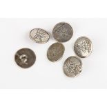A set of six Dutch silver buttons
engraved with a scene of windmills, 1.75 cm diameter.Condition: