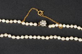 A natural pearl necklace with diamond claspof 107 pearls each measuring approximately 3.5mm in