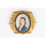 A 19th century portrait miniature of a gentleman
painted on ivory, the gentleman wearing a blue