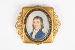 A 19th century portrait miniature of a gentlemanpainted on ivory, the gentleman wearing a blue
