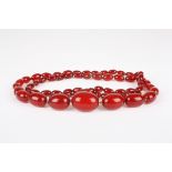 A late 19th century cherry amber necklace
the graduated beads with screw fastener, overall length