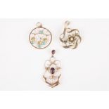 Three Edwardian gold pendants
one decorated with seed pearls, one with amethyst and the third with