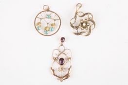 Three Edwardian gold pendantsone decorated with seed pearls, one with amethyst and the third with