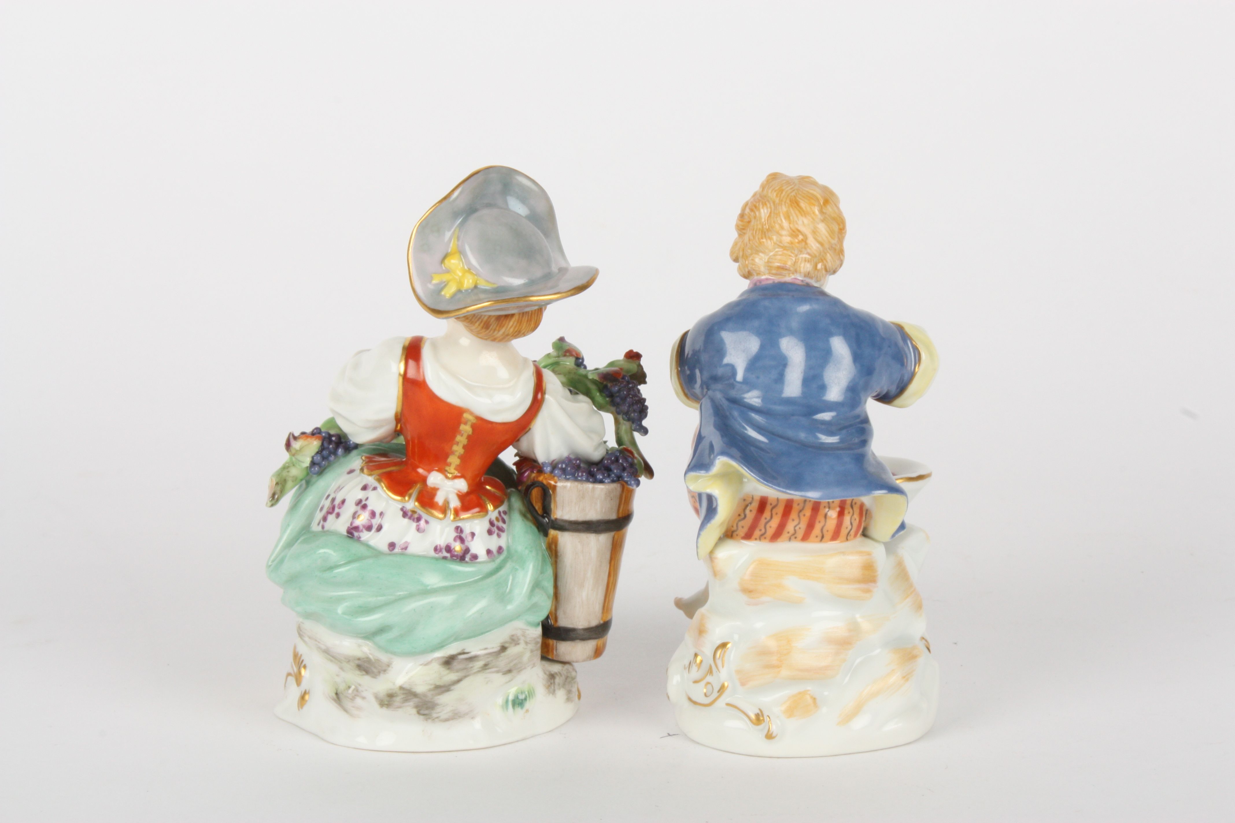 Pair of late 20th century Meissen gardener boy and girl, each modelled seated, girl with basket of - Image 2 of 5