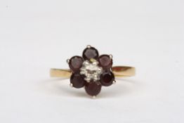 A garnet and diamond daisy cluster ringset in 18ct gold, Size P 1/2.Condition: Good condition
