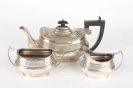 A George V silver three piece matched tea sethallmarked Birmingham 1926 and Chester, with gadrooned