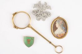 A small group of objets d'artcomprising an oval portrait miniature, a paste clip brooch, an