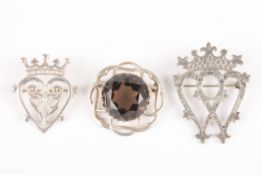 A group of three Scottish silver broochesincluding an Iona pierced and engraved silver brooch and