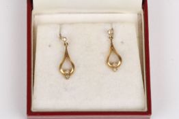 A pair of 9ct gold and diamond drop earringsset in pear shaped mounts, Condition: Good condition