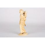 A late 19th century Japanese carved ivory figure of a mother and child
finely carved, the child